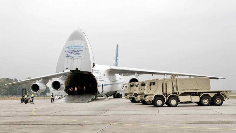 Antonov aircraft loads completed armored trucks after production.